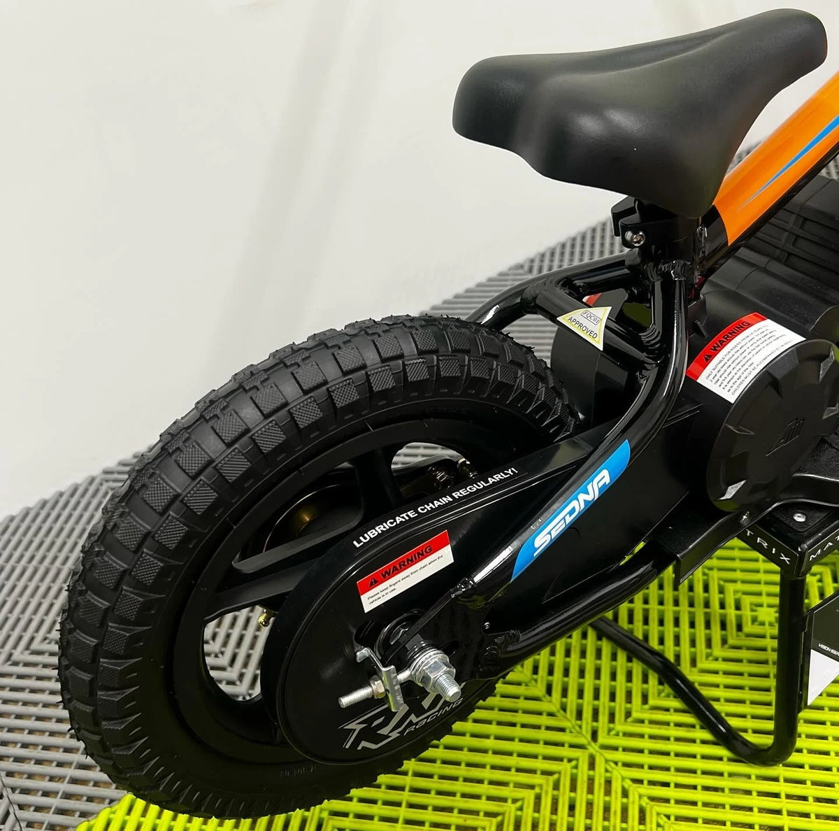 Revvi 12 Electric Bike, Stabilisers & Helmet Bundle – Orange
