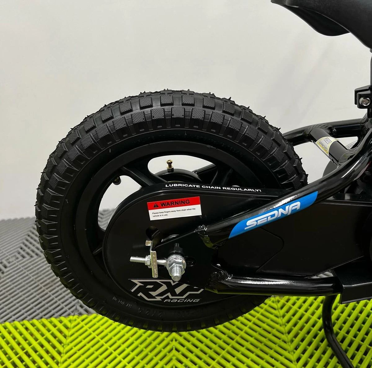 Revvi 12 Electric Bike, Stabilisers & Helmet Bundle – Green