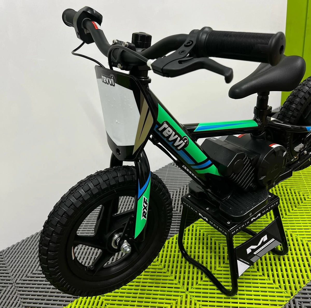 Revvi 12 Electric Bike, Stabilisers & Helmet Bundle – Green